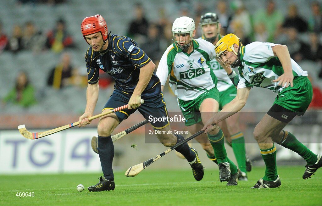 30 October 2010; Ronald Ross, Scotland, in action against Arron Graffin and Tom Murnane right, Ireland. Senior Hurling / Shinty International 1st Test, Ireland v Scotland, Croke Park, Dublin. Picture credit: Diarmuid Greene / SPORTSFILE