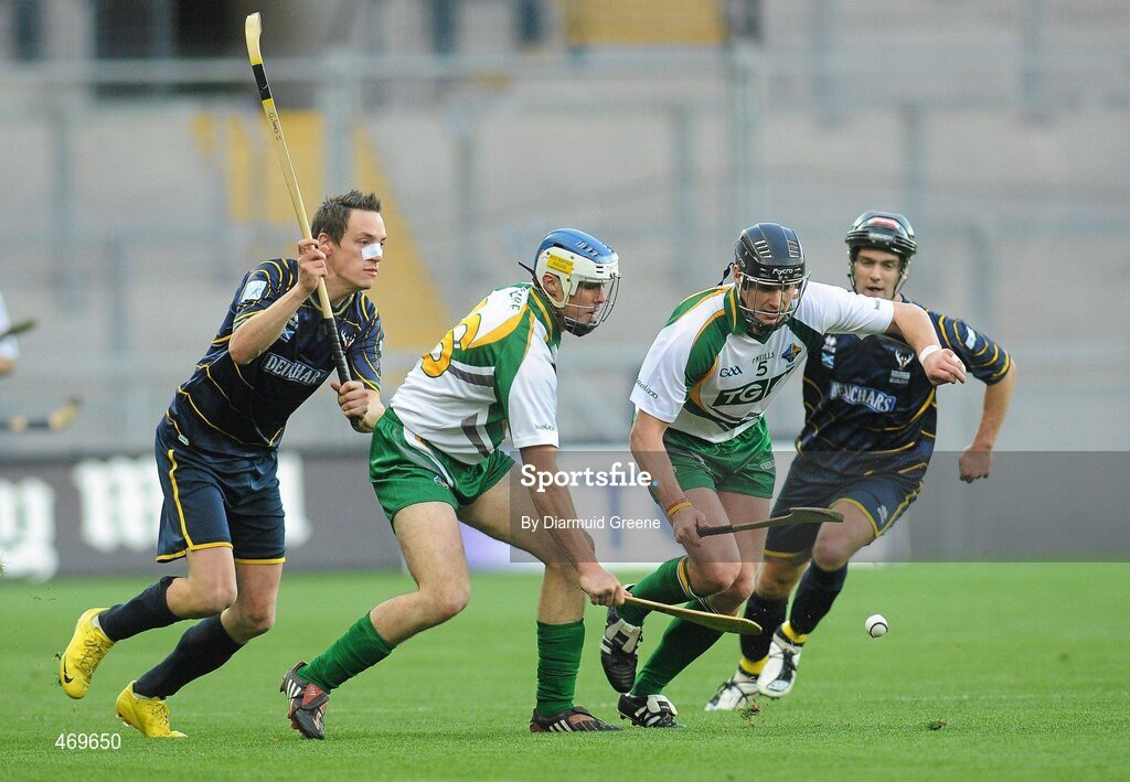 30 October 2010; Shane Dooley and Jackie Tyrrell, Ireland, in action against Gary Innes, left, and Finlay Macrae,  Scotland. Senior Hurling / Shinty International 1st Test, Ireland v Scotland, Croke Park, Dublin. Picture credit: Diarmuid Greene / SPORTSFILE