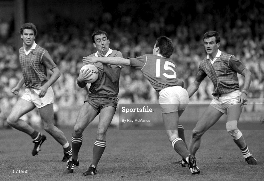 24 August 1986; Denis 'Ogie' Moran of Kerry in action against meath players, from left, Liam Hayes, Bernard Flynn and Colm O'Rourke during the All-Ireland Senior Football Championship Semi-Final match between Meath and Kerry at Croke Park in Dublin. Photo by Ray McManus/Sportsfile