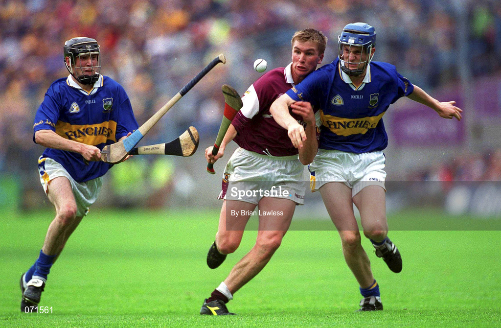 12 August 2001; Kevin Hayes of Galway in action against Tipperary's Pat Buckley, right, and Dara Walton during the All-Ireland Minor Hurling Championship Semi-Final between Galway and Tipperary at Croke Park in Dublin. Photo by Brian Lawless/Sportsfile