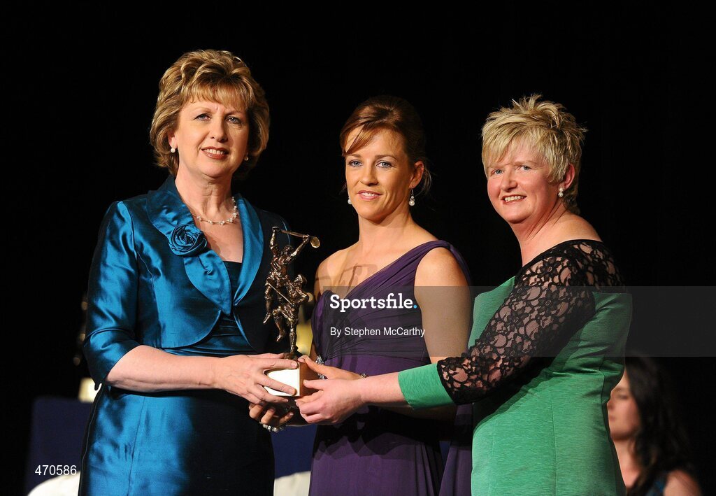 6 November 2010; Kate Kelly, Wexford, is presented with her 2010 Camogie All-Star award by President Mary McAleese and President of the Camogie Association Joan O' Flynn at the 2010 Camogie All-Stars in association with ONeills. Citywest Hotel, Saggart, Co. Dublin. Picture credit: Stephen McCarthy / SPORTSFILE