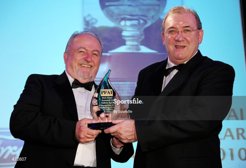 6 November 2010; Eoin Hand, right, presenting the Merit Award to Gabriel Egan of RTE Radio. PFAI Ford 2010 Awards, The Burlington Hotel, Upper Leeson Street, Dublin. Photo by Sportsfile