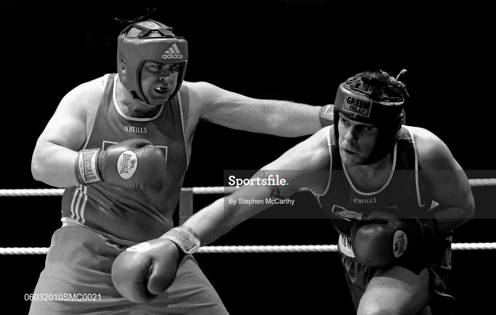 6 March 2010; Trevor Foley, Crumlin, left, exchanges punches with Jonathan York, Springhill, during their men's novice 91+kg bout. Men's Novice National Championships 2010 Finals - Saturday Afternoon Session, National Stadium, Dublin. Picture credit: Stephen McCarthy / SPORTSFILE