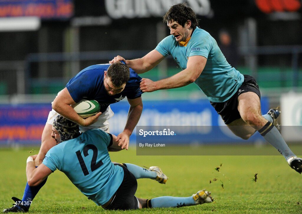 21 November 2010; Dave Campbell, St Marys College, is tackled by Dave McSharry, 12, and Shane Grannell, UCD. Leinster Senior League Cup Final, St Marys College v UCD, Donnybrook Stadium, Donnybrook, Dublin. Picture credit: Ray Lohan / SPORTSFILE