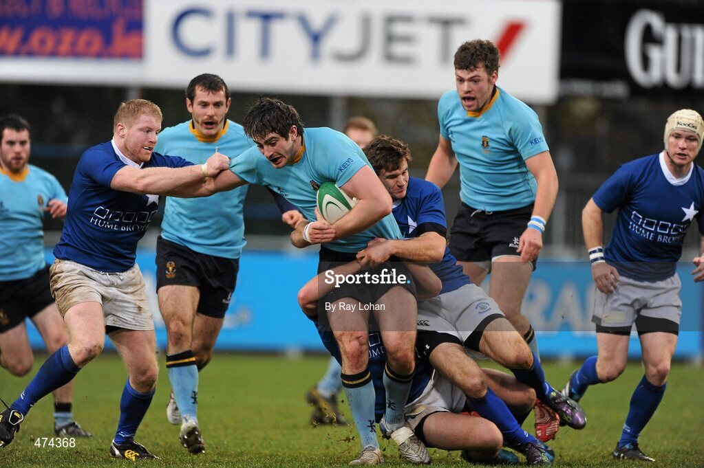 21 November 2010; Danny Kenny, UCD, is tackled by Damien Hall, left, and Mark Sexton, St. Marys College. Leinster Senior League Cup Final, St Marys College v UCD, Donnybrook Stadium, Donnybrook, Dublin. Picture credit: Ray Lohan / SPORTSFILE.