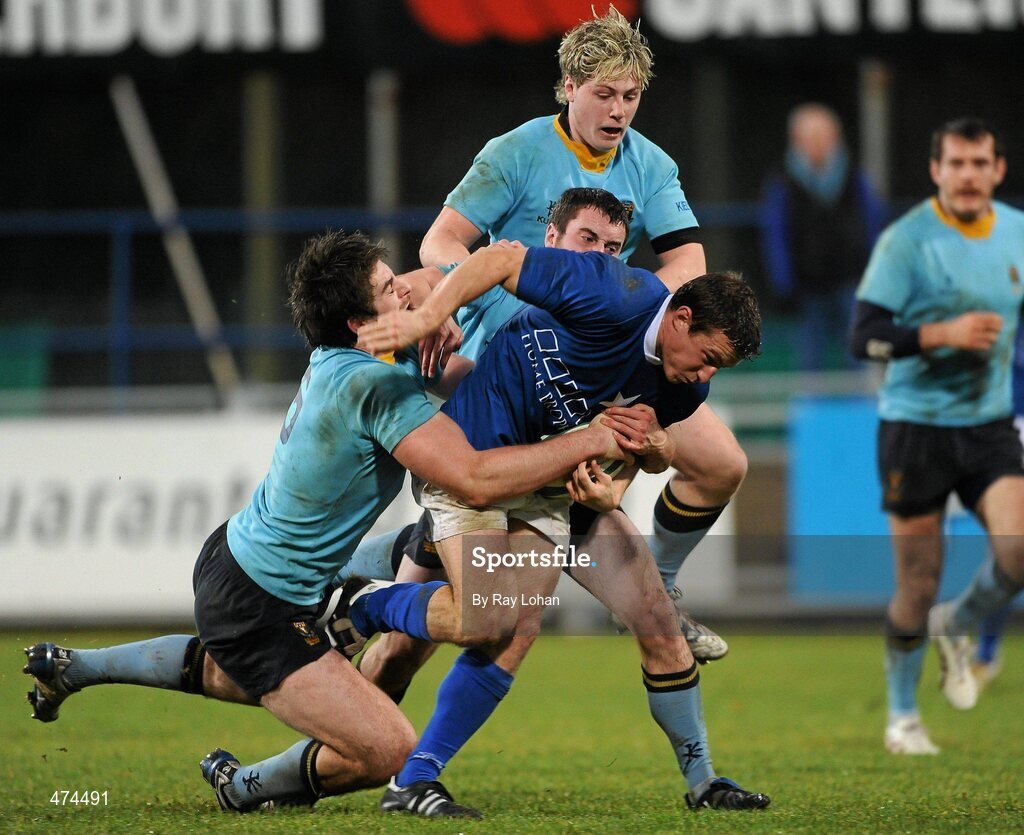 21 November 2010; Colm McMahon, St Marys College, is tackled by Shane Grannell, Shane O'Meara and Richie Bent, UCD. Leinster Senior League Cup Final, St Marys College v UCD, Donnybrook Stadium, Donnybrook, Dublin. Picture credit: Ray Lohan / SPORTSFILE