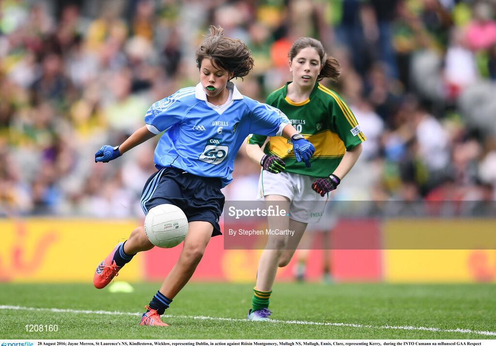28 August 2016; Jayne Merren, St Laurence's NS, Kindlestown, Wicklow, representing Dublin, in action against Róisín Montgomery, Mullagh NS, Mullagh, Ennis, Clare, representing Kerry,  during the INTO Cumann na mBunscol GAA Respect Exhibition Go Games at the GAA Football All-Ireland Senior Championship Semi-Final game between Dublin and Kerry at Croke Park in Dublin. Photo by Stephen McCarthy/Sportsfile