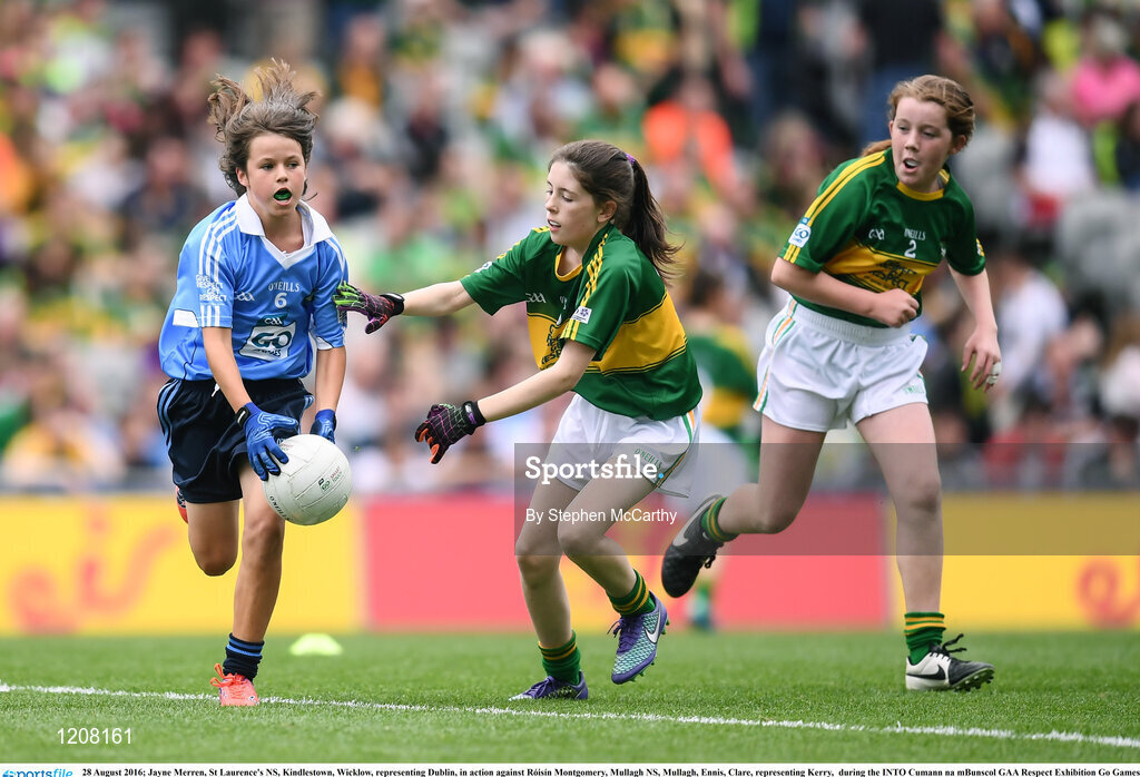 28 August 2016; Jayne Merren, St Laurence's NS, Kindlestown, Wicklow, representing Dublin, in action against Róisín Montgomery, Mullagh NS, Mullagh, Ennis, Clare, representing Kerry,  during the INTO Cumann na mBunscol GAA Respect Exhibition Go Games at the GAA Football All-Ireland Senior Championship Semi-Final game between Dublin and Kerry at Croke Park in Dublin. Photo by Stephen McCarthy/Sportsfile
