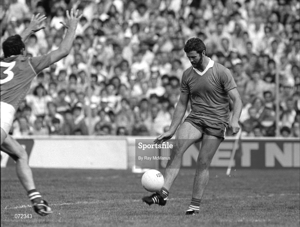 24 August 1986; Eoin 'Bomber' Liston of Kerry scores a point despite the efforts of Mick Lyons of Meath during the All-Ireland Senior Football Championship Semi-final match between Meath and Kerry at Croke Park in Dublin. Photo by Ray McManus/Sportsfile