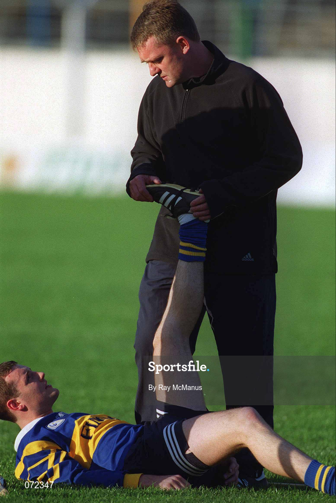 30 August 2001; Paul Kelly is assisted with stretching exercises with the help of manager Nicky English during a Tipperary hurling training session prior to the All-Ireland Hurling Final at Semple Stadium in Thurles, Tipperary. Photo by Ray McManus/Sportsfile