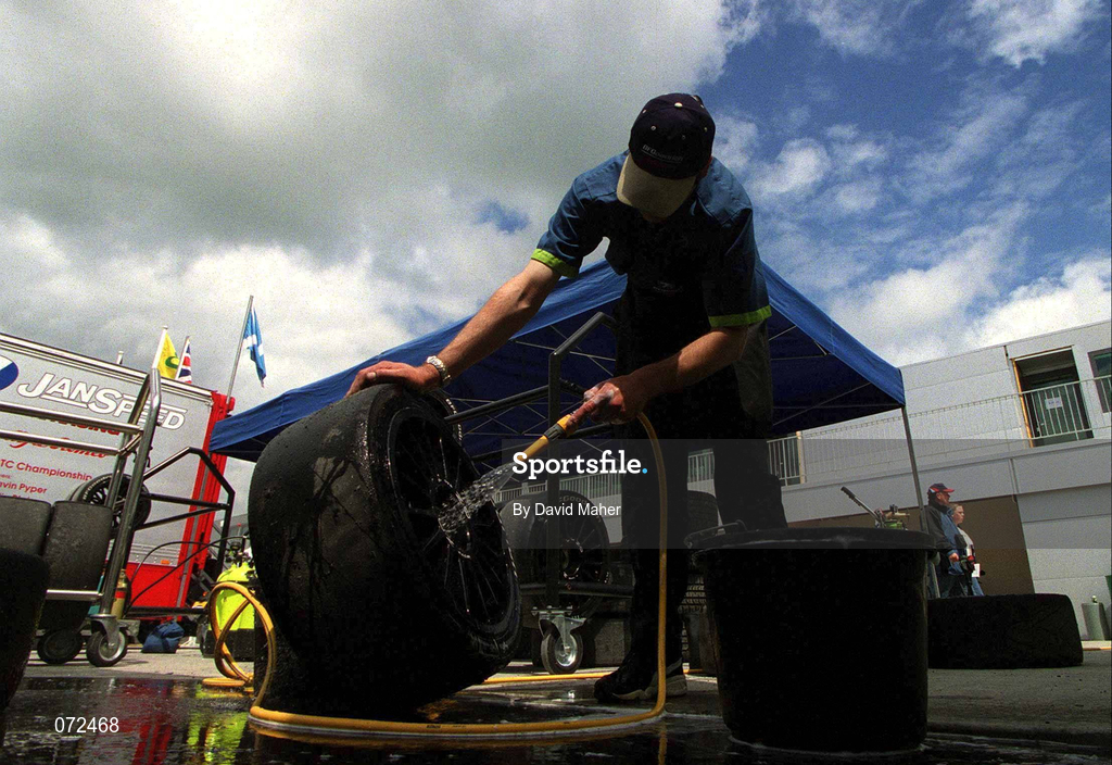 17 June 2001; A mechanic washes the wheels and tyres which will be used during the Feature Race during Round 5 of the British Touring Car Championship at Mondello Park in Naas, Kildare. Photo by David Maher/Sportsfile