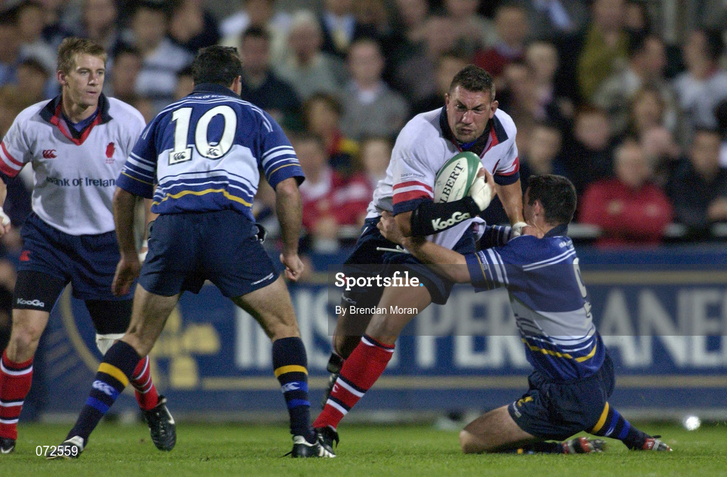 31 August 2001; Justin Fitzpatrick of Ulster is tackled by Brian O'Meara, right, and Nathan Spooner of Leinster during the Celtic League match between Leinster and Ulster at Donnybrook Stadium in Dublin. Photo by Brendan Moran/Sportsfile