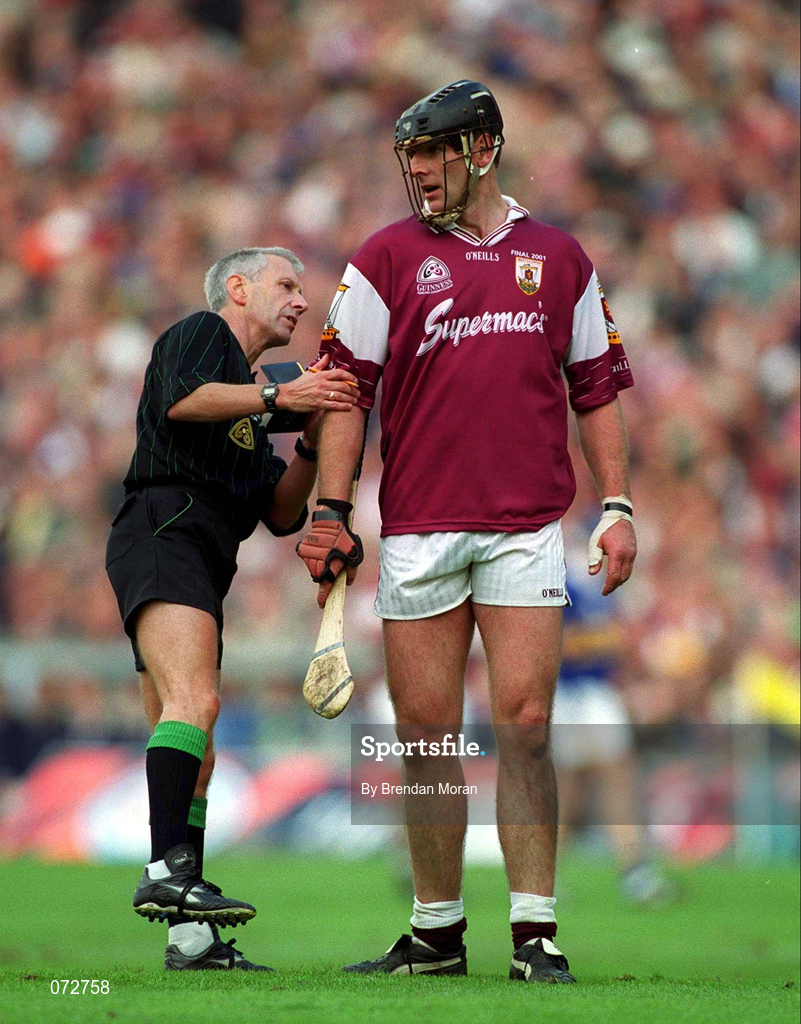 9 September 2001; Referee Pat O'Connor checks Joe Rabbitte of Galway number on his shirt before booking Rabbitte's team-mate during the Guinness All-Ireland Senior Hurling Championship Final match between Tipperary and Galway at Croke Park in Dublin. Photo by Brendan Moran/Sportsfile