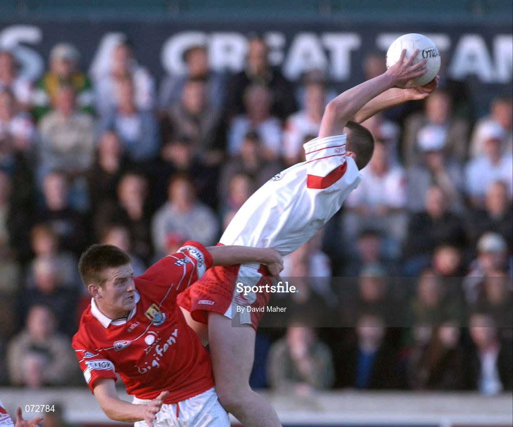 9 September 2001; Peter Donnelly of Tyrone in action against Derek Kavanagh of Cork during the All-Ireland Under 21 Football Championship Semi-Final match between Tyrone and Cork at Parnell Park in Dublin. Photo by David Maher/Sportsfile