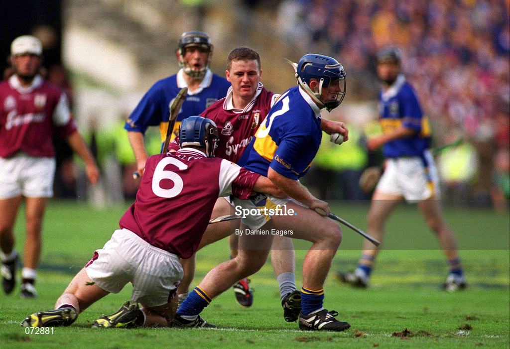 9 September 2001; Eugene O'Neill of Tipperary in action against Liam Hodgins, 6, and Derek Hardiman of Galway during the Guinness All-Ireland Senior Hurling Championship Final match between Tipperary and Galway at Croke Park in Dublin. Photo by Damien Eagers/Sportsfile