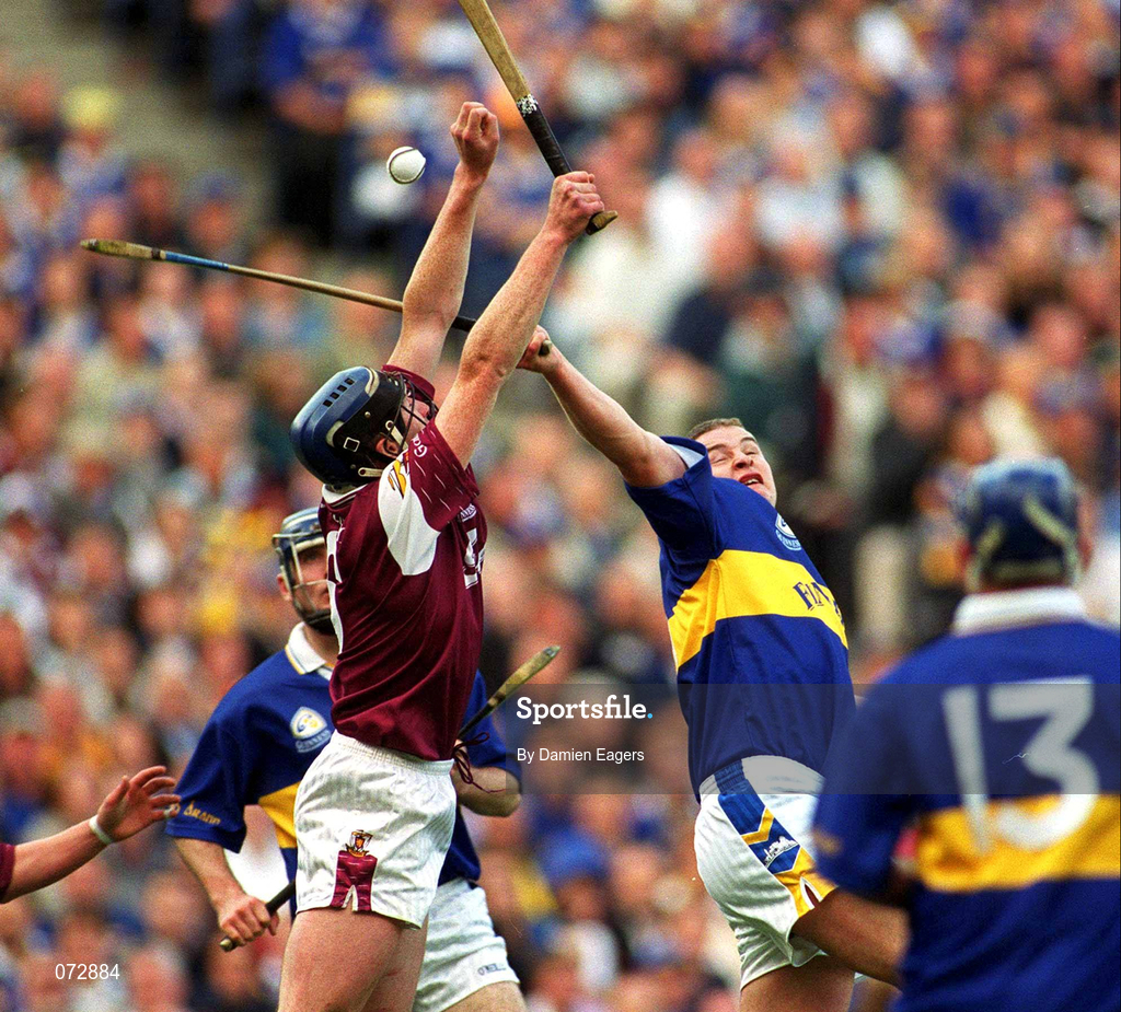 9 September 2001; Liam Hodgins of Galway wins the sliothar ahead of John Carroll of Tipperary during the Guinness All-Ireland Senior Hurling Championship Final match between Tipperary and Galway at Croke Park in Dublin. Photo by Damien Eagers/Sportsfile