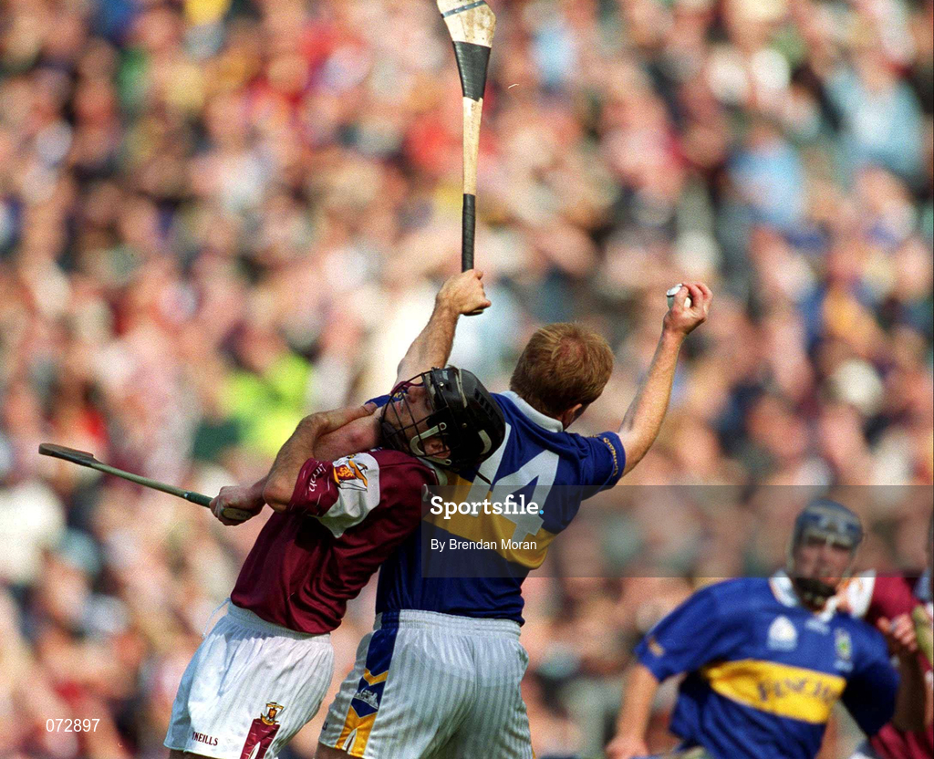 9 September 2001; Declan Ryan of Tipperary wins the sliotar despite the intentions of Michael Healy of Galway during the Guinness All-Ireland Senior Hurling Championship Final match between Tipperary and Galway at Croke Park in Dublin. Photo by Brendan Moran/Sportsfile