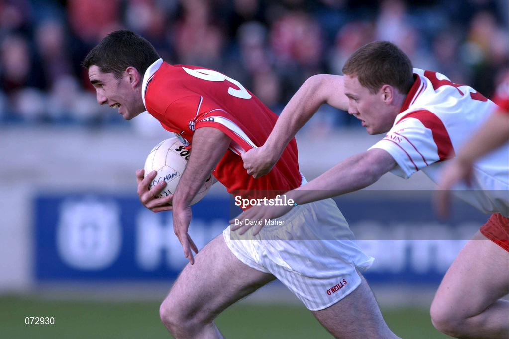 9 September 2001; David Niblock of Cork in action against Cormac McAnallen of Tyrone during the All-Ireland Under 21 Football Championship Semi-Final match between Tyrone and Cork at Parnell Park in Dublin. Photo by David Maher/Sportsfile