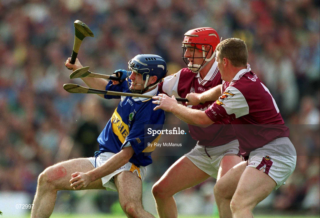 9 September 2001; Eoin Kelly of Tipperary is tackled by Ollie Canning, centre, and Gregory Kennedy of Galway during the Guinness All-Ireland Senior Hurling Championship Final match between Tipperary and Galway at Croke Park in Dublin. Photo by Ray McManus/Sportsfile