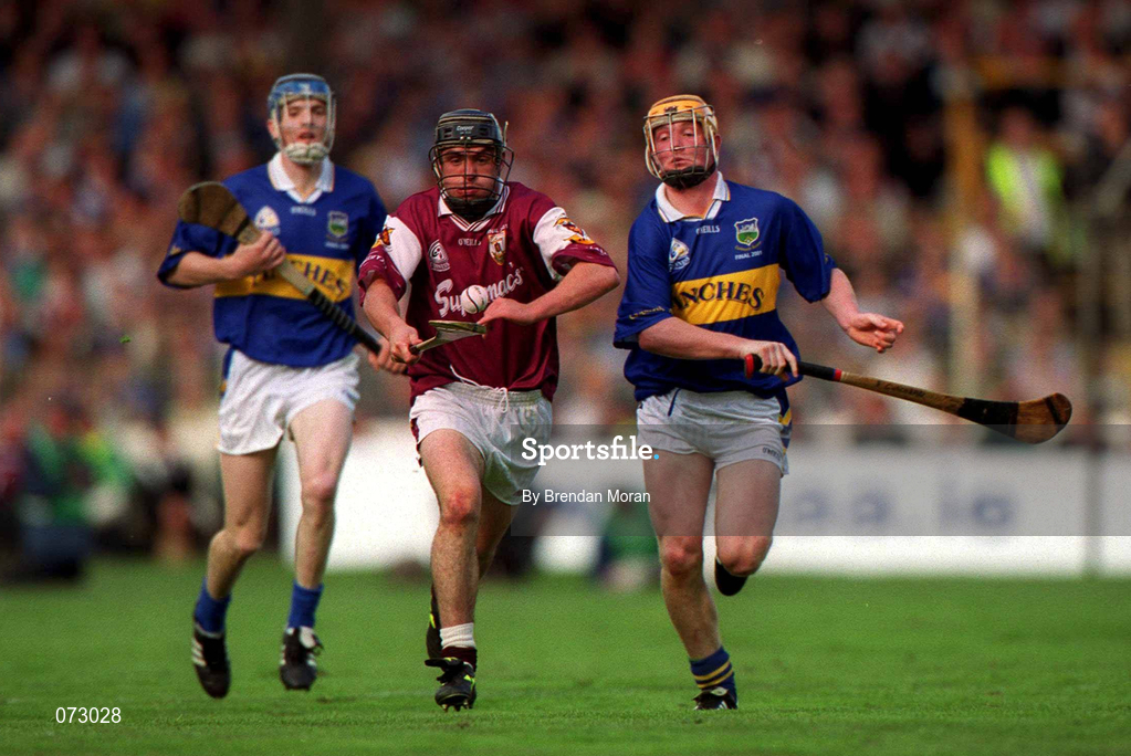 9 September 2001; Alan Kerins of Galway races clear of Eamonn Corcoran, right, and Lar Corbett of Tipperary during the Guinness All-Ireland Senior Hurling Championship Final match between Tipperary and Galway at Croke Park in Dublin. Photo by Brendan Moran/Sportsfile