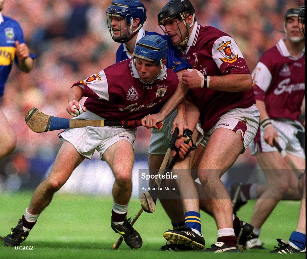 9 September 2001; Kevin Broderick of Galway, supported by team-mate Joe Rabbitte, is tackled by Paul Kelly of Tipperary during the Guinness All-Ireland Senior Hurling Championship Final match between Tipperary and Galway at Croke Park in Dublin. Photo by Brendan Moran/Sportsfile