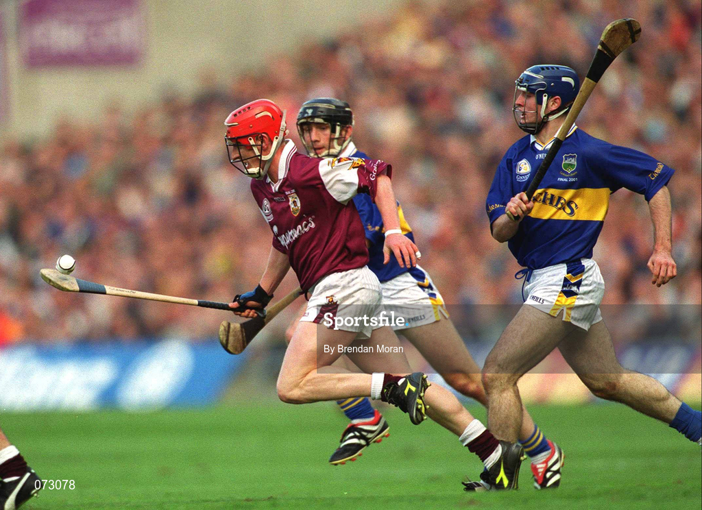 9 September 2001; Ollie Canning of Galway breaks through Mark O'Leary and Eoin Kelly of Tipperary during the Guinness All-Ireland Senior Hurling Championship Final match between Tipperary and Galway at Croke Park in Dublin. Photo by Brendan Moran/Sportsfile