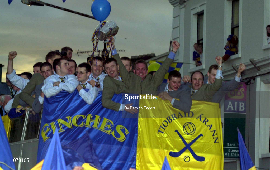10 September 2001; Tipperary manager Nicky English lifts the Liam MacCarthy cup accompanied by Tipperary players on an open top bus during the homecoming of the All-Ireland hurling champions Tipperary in Thurles, Tipperary. Photo by Damien Eagers/Sportsfile