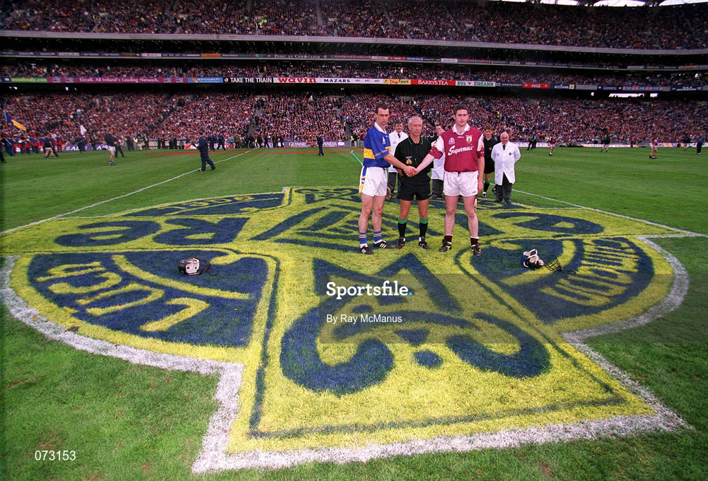 9 September 2001; Team captains Thomas Dunne of Tipperary and Liam Hodgins of Galway shake hands, in the company of referee Pat O'Connor, prior to the Guinness All-Ireland Senior Hurling Championship Final match between Tipperary and Galway at Croke Park in Dublin. Photo by Ray McManus/Sportsfile