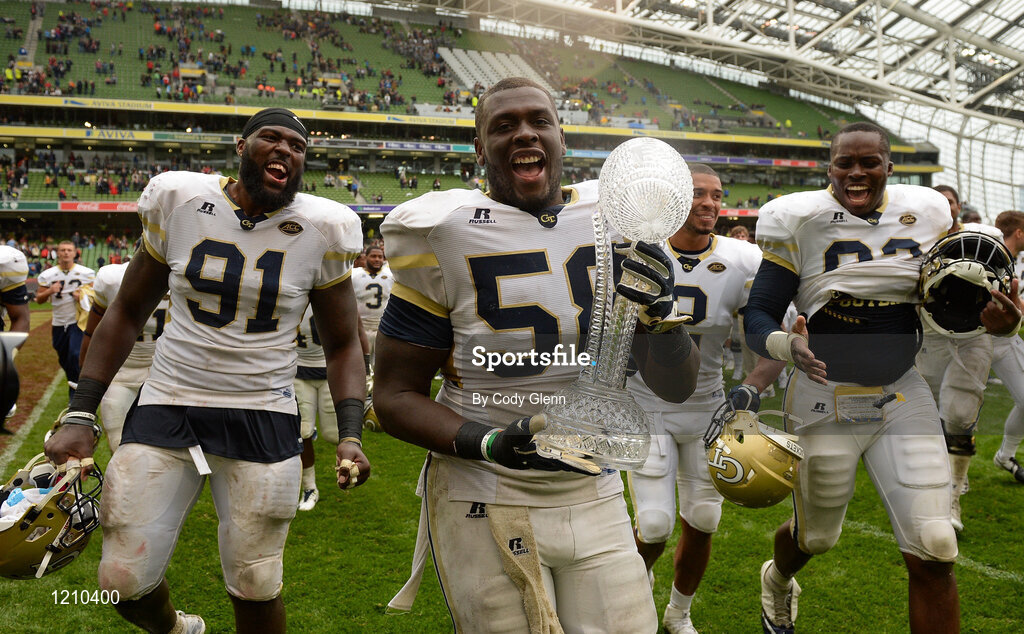 3 September 2016; Georgia Tech's Freddie Burden (with trophy) and team-mates celebrate winning the Aer Lingus College Football Classic match between Boston College Eagles and Georgia Tech Yellow Jackets at the Aviva Stadium in Lansdowne Road, Dublin. Photo by Cody Glenn/Sportsfile