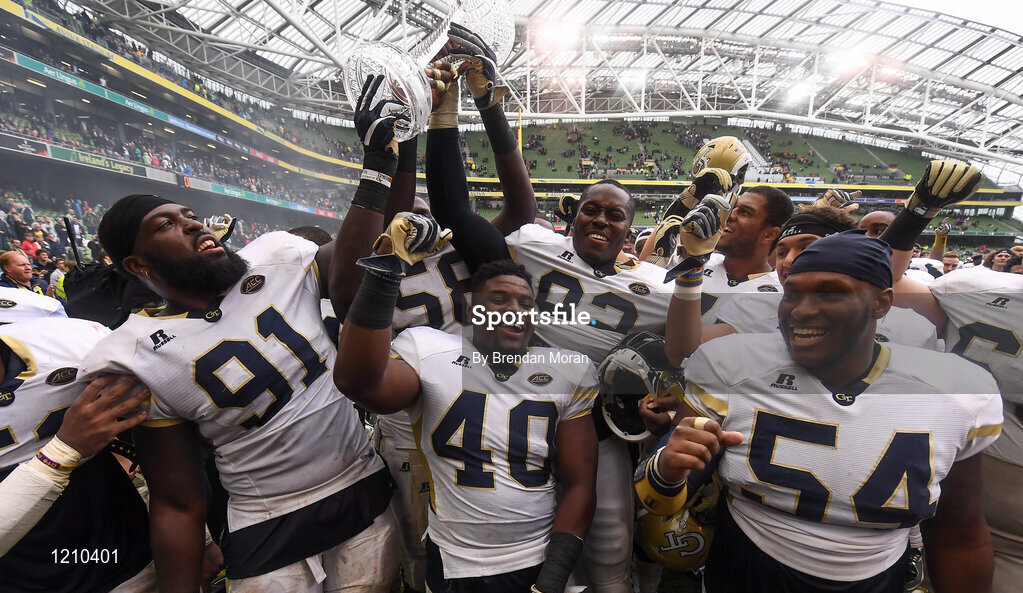 3 September 2016; Georgia Tech players, from left, Patrick Gamble, P.J. Davis, Francis Kallon and Kyle Cerge-Henderson celebrate with the trophy after winning the Aer Lingus College Football Classic match between Boston College Eagles and Georgia Tech Yellow Jackets at the Aviva Stadium in Lansdowne Road, Dublin. Photo by Brendan Moran/Sportsfile