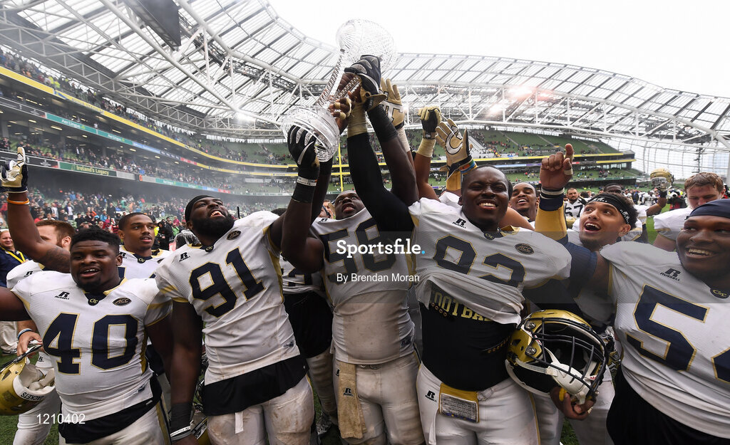 3 September 2016; Georgia Tech players, from left, P.J. Davis, Patrick Gamble, Freddie Burden, Francis Kallon and Kyle Cerge-Henderson celebrate with the trophy after winning the Aer Lingus College Football Classic match between Boston College Eagles and Georgia Tech Yellow Jackets at the Aviva Stadium in Lansdowne Road, Dublin. Photo by Brendan Moran/Sportsfile