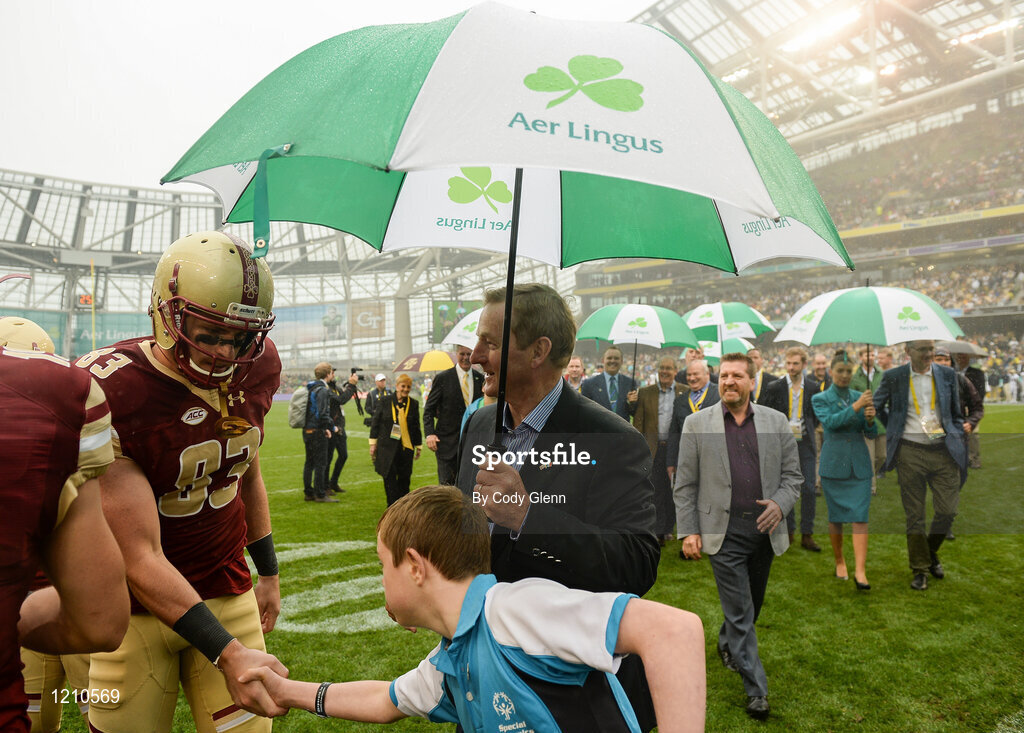 3 September 2016; Special Olympics athlete Joe Whelan, age 13, from Dún Laoghaire, Co Dublin, shakes hands with Boston College wide receiver Charlie Callinan alongside An Taoiseach Enda Kenny T.D. during the Aer Lingus College Football Classic match between Boston College Eagles and Georgia Tech Yellow Jackets at the Aviva Stadium in Lansdowne Road, Dublin. Photo by Cody Glenn/Sportsfile