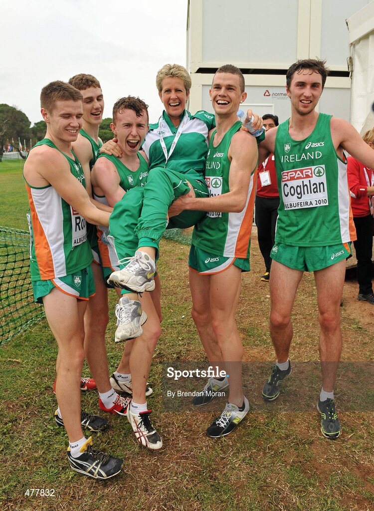12 December 2010; Ireland U23 men's team, from left, David Rooney, Michael Mulhare, Brendan O'Neill, David McCarthy and John Coghlan lift team manager Ann Keenan Buckley after they had secured the team gold medal. 17th SPAR European Cross Country Championships, Albufeira, Portugal. Picture credit: Brendan Moran / SPORTSFILE