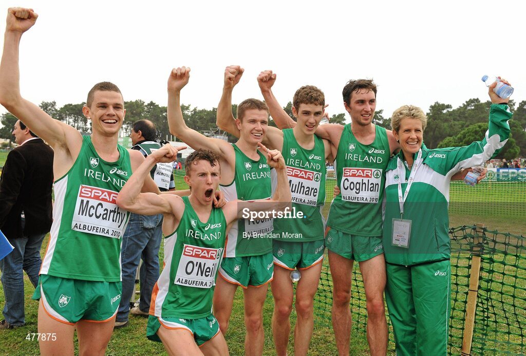 12 December 2010; The Ireland U23 men's team, from left, David McCarthy, Brendan O'Neill, David Rooney, Michael Mulhare and John Coghlan celebrate with team manager Ann Keenan Buckley after winning the team gold. Ciaran O Lionaird missed the presentation of medals as he was with medical personnel. 17th SPAR European Cross Country Championships, Albufeira, Portugal. Picture credit: Brendan Moran / SPORTSFILE
