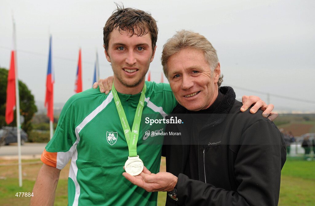 12 December 2010; Eamonn Coghlan with his son John and the team gold medal John won in the Men's U23 race. 17th SPAR European Cross Country Championships, Albufeira, Portugal. Picture credit: Brendan Moran / SPORTSFILE