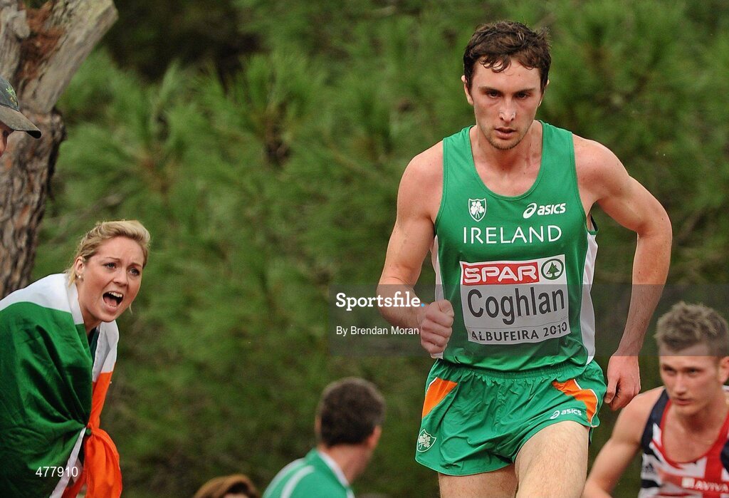 12 December 2010; Ireland's John Coghlan is encouraged by an Irish supporter during the Men's U23 race where Ireland won the team gold. 17th SPAR European Cross Country Championships, Albufeira, Portugal. Picture credit: Brendan Moran / SPORTSFILE