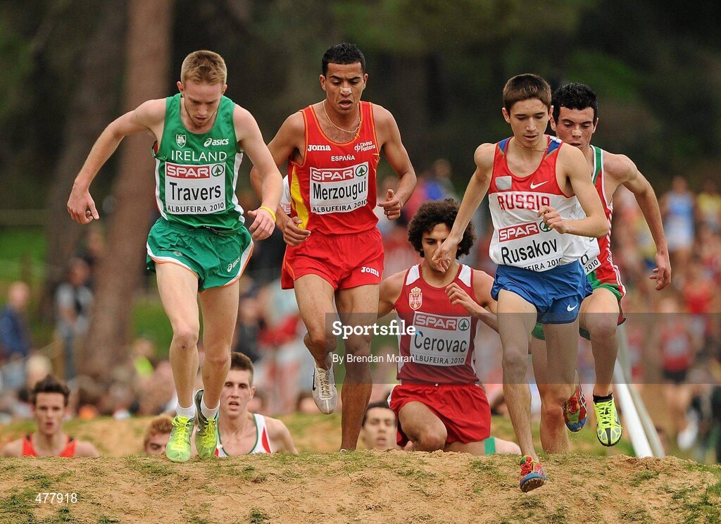 12 December 2010; Ireland's John Travers competes alongside eventual winner Abdelaziz Merzougui of Spain, on his way to finishing in 25th place in the Men's Junior race with a time of 18:45. 17th SPAR European Cross Country Championships, Albufeira, Portugal. Picture credit: Brendan Moran / SPORTSFILE