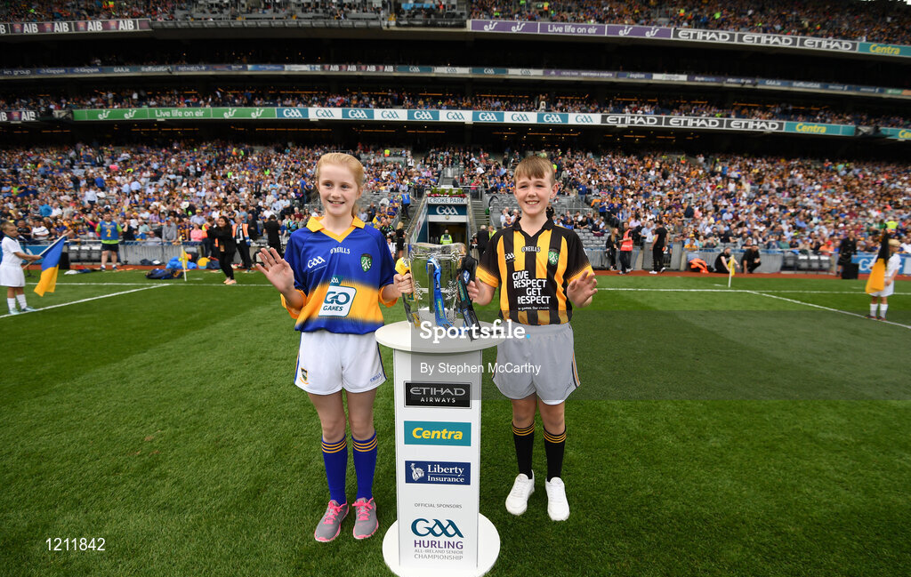 4 September 2016; Ciara Prout, Inch NS, Co. Tipperary, and David Dungan, Scoil Chronain, Rathcoole, Dublin, bring the Liam MacCarthy onto the pitch prior to the GAA Hurling All-Ireland Senior Championship Final match between Kilkenny and Tipperary at Croke Park in Dublin. Photo by Stephen McCarthy/Sportsfile