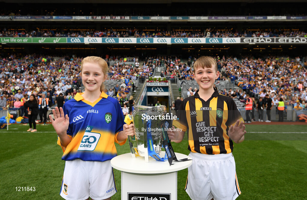 4 September 2016; Ciara Prout, Inch NS, Co. Tipperary, and David Dungan, Scoil Chronain, Rathcoole, Dublin, bring the Liam MacCarthy onto the pitch prior to the GAA Hurling All-Ireland Senior Championship Final match between Kilkenny and Tipperary at Croke Park in Dublin. Photo by Stephen McCarthy/Sportsfile