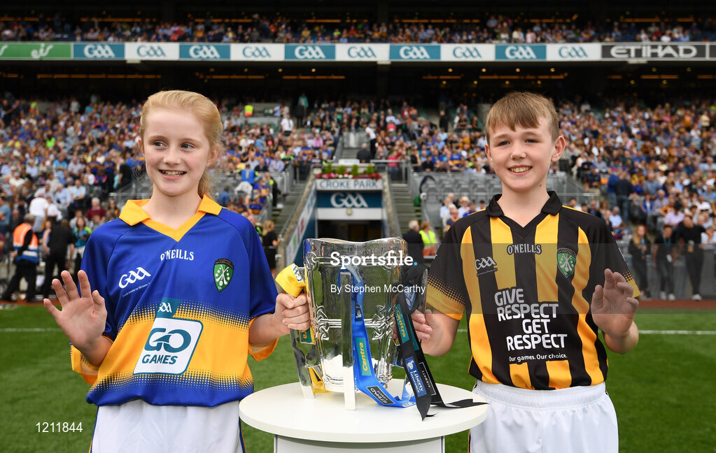 4 September 2016; Ciara Prout, Inch NS, Co. Tipperary, and David Dungan, Scoil Chronain, Rathcoole, Dublin, bring the Liam MacCarthy onto the pitch prior to the GAA Hurling All-Ireland Senior Championship Final match between Kilkenny and Tipperary at Croke Park in Dublin. Photo by Stephen McCarthy/Sportsfile
