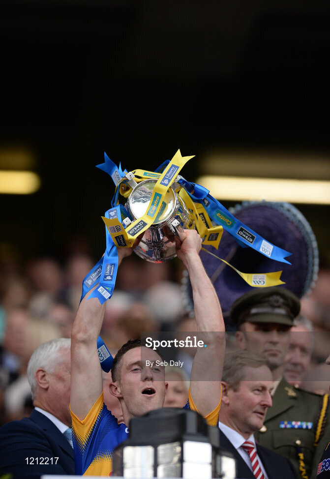 4 September 2016; Michael Cahill of Tipperary lifts the trophy following his team's victory in the GAA Hurling All-Ireland Senior Championship Final match between Kilkenny and Tipperary at Croke Park in Dublin. Photo by Seb Daly/Sportsfile