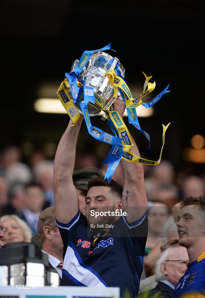 4 September 2016; Darragh Mooney of Tipperary lifts the trophy following his team's victory in the GAA Hurling All-Ireland Senior Championship Final match between Kilkenny and Tipperary at Croke Park in Dublin. Photo by Seb Daly/Sportsfile