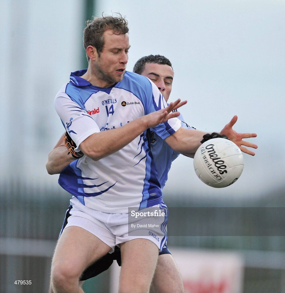 1 January 2011; Brian Kavanagh, Dubs Stars, in action against Paul Brogan, Dublin. Annual Football Challenge, Dublin v Dubs Stars, St Brigid's GAA Club, Russell Park, Blanchardstown, Dublin. Picture credit: David Maher / SPORTSFILE