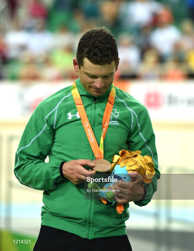 9 September 2016; Eoghan Clifford of Ireland looks at his bronze medal during the presentation after finishing third in the Men's C3 3000m Individual Pursuit Final at the Rio Olympic Velodrome during the Rio 2016 Paralympic Games in Rio de Janeiro, Brazil. Photo by Diarmuid Greene/Sportsfile