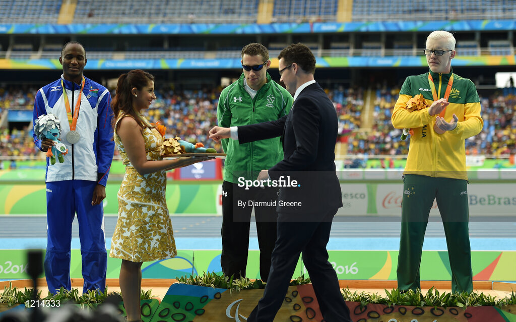 9 September 2016; Jason Smyth of Ireland is presented with his gold medal by Patrick O'Donovan TD, Minister of State for Tourism and Sport, after the Men's 100m - T13 Final at the Rio Olympic Stadium during the Rio 2016 Paralympic Games in Rio de Janeiro, Brazil. Photo by Diarmuid Greene/Sportsfile
