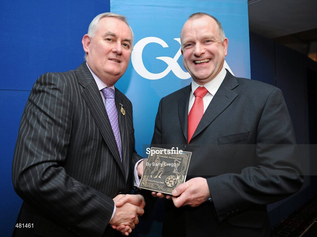 15 January 2011; Retiring referee Tommy McIntyre, from Co. Antrim, is presented with his referee's award by Uachtarán CLG Criostóir Ó Cuana. 2010 National Referees' Awards Banquet, Croke Park, Dublin. Picture credit: Barry Cregg / SPORTSFILE
