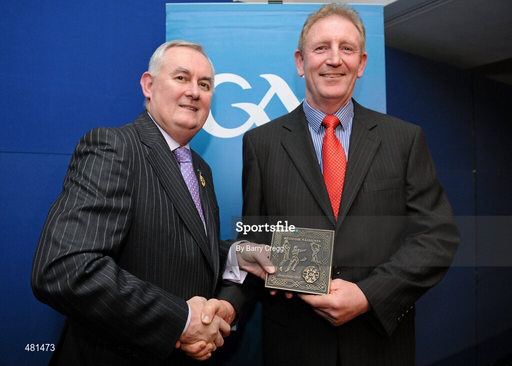 15 January 2011; Retiring referee Michael McGann, from Co. Clare, is presented with his  referee's award by Uachtarán CLG Criostóir Ó Cuana. 2010 National Referees' Awards Banquet, Croke Park, Dublin. Picture credit: Barry Cregg / SPORTSFILE