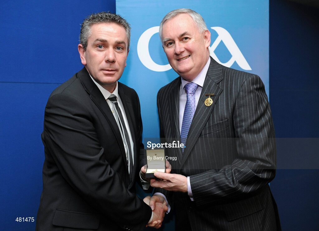 15 January 2011; Referee Garrett Duffy, from Co. Antrim, who refereed the AIB GAA Hurling All-Ireland Junior Club Championship 2009/2010, is presented with his  referee's award by Uachtarán CLG Criostóir Ó Cuana. 2010 National Referees' Awards Banquet, Croke Park, Dublin. Picture credit: Barry Cregg / SPORTSFILE
