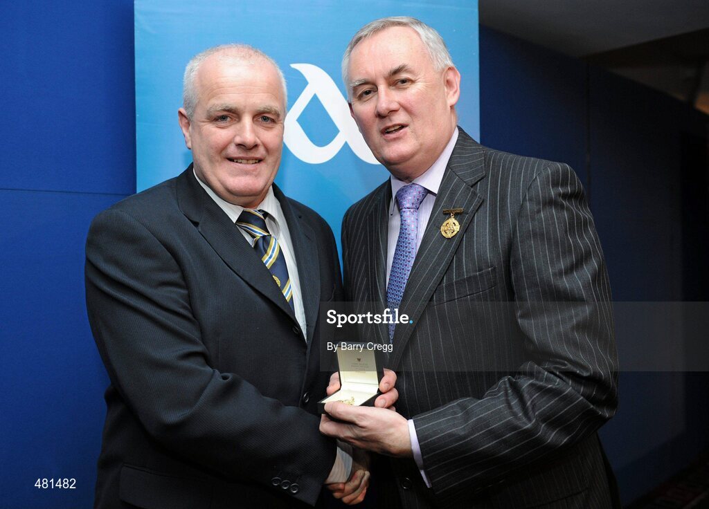 15 January 2011; Referee Sean Carroll, from Co. Westmeath, who refereed the AIB GAA Football All-Ireland Junior Club Championship 2009/2010, is presented with his  referee's award by Uachtarán CLG Criostóir Ó Cuana. 2010 National Referees' Awards Banquet, Croke Park, Dublin. Picture credit: Barry Cregg / SPORTSFILE