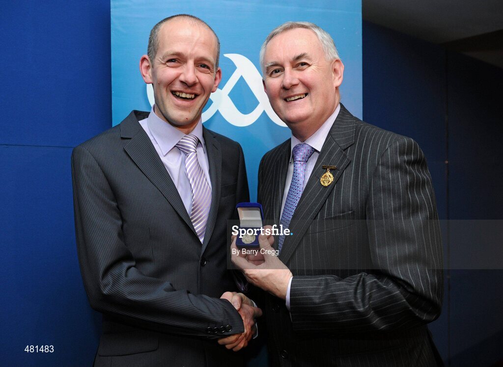 15 January 2011; Referee Cathal McAllister, from Co. Cork, who refereed the AIB GAA Hurling All-Ireland Senior Club Championship 2009/2010, is presented with his  referee's award by Uachtarán CLG Criostóir Ó Cuana. 2010 National Referees' Awards Banquet, Croke Park, Dublin. Picture credit: Barry Cregg / SPORTSFILE